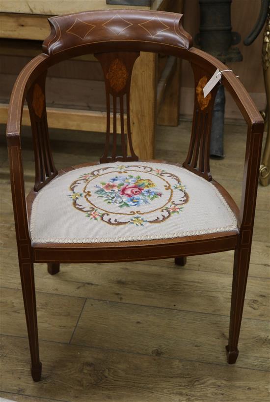 An Edwardian inlaid mahogany tub chair